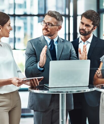 Business,Man,,Laptop,And,Meeting,With,Group,For,Presentation,Of Business,Man,,Laptop,And,Meeting,With,Group,For,Presentation,Of